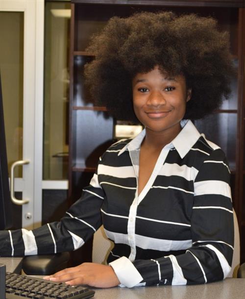 Banking student in the role of a bank teller 